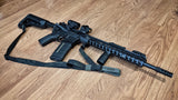 Multicam black TOIM customizable quick adjust two point sling with laser engraved text on pull tab attached to a palmetto state armory ar-15