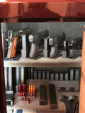 interior of safe with magazines and guns organized neatly in mag holders and gun display stands