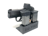 sig p365 on gun stand with dust cover on holosun 507k or 407k optic and magazines